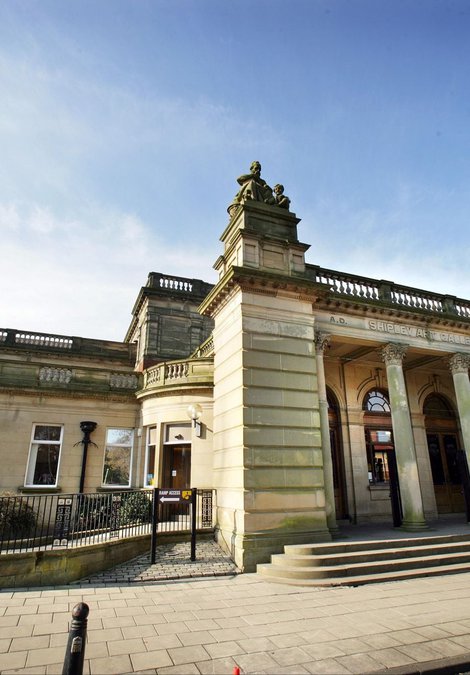 Exterior of the Shipley Art Gallery, stone building with two towers.
