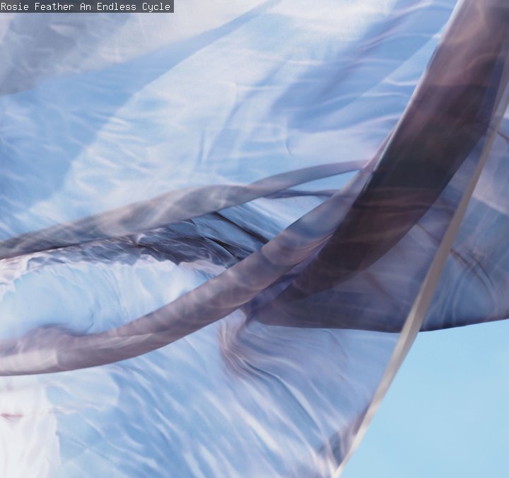 An abstract artwork with tones of grey and blue