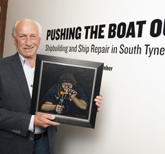 Robert (Bob) Olley holding his painting entitled ‘Fag Break’