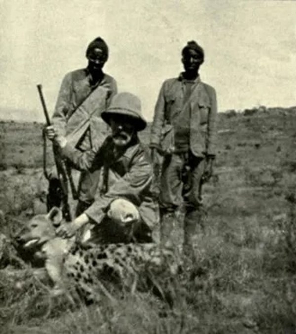 Elmi Hasan, Abel Chapman and an unknown Game Tracker with a dead Hyena, British East Africa, 1904.