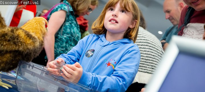 Discover Festival - a young child takes part in a worshop