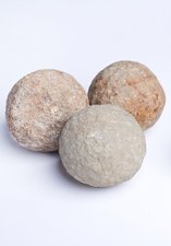 Four round stones used for throwing