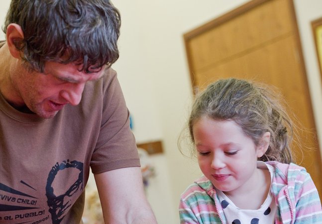 Dad and daughter engage in craft activity 