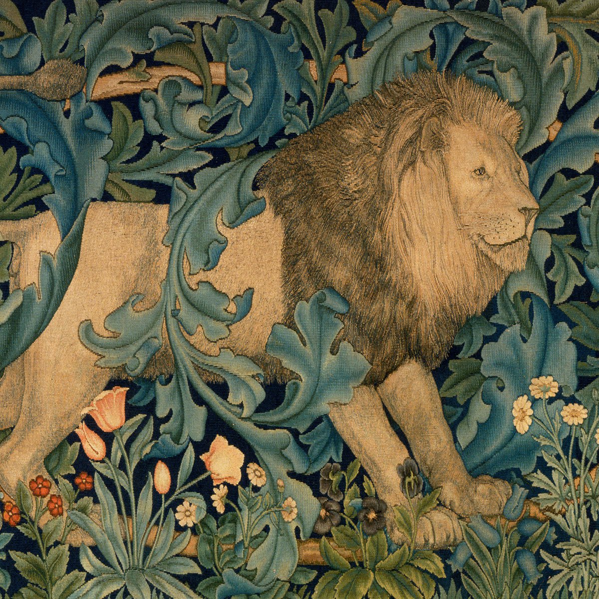 Tapestry showing a lion among forest foliage and flowers.