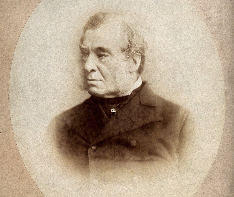 black and white image of a man in a black coat