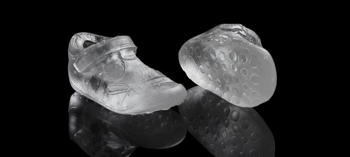 A pair of trainers made from glass.