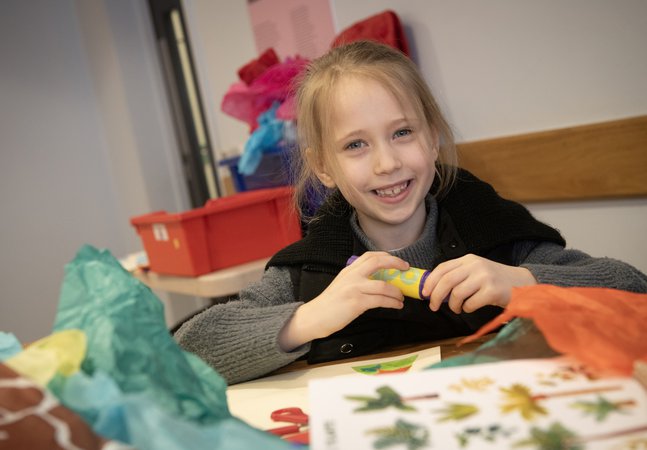 A child is crafting. 