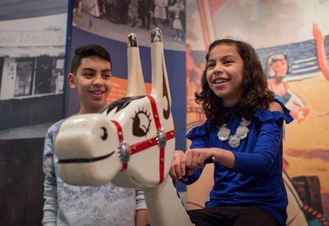 two children ride Muffin the Mule