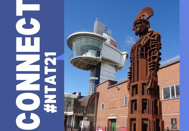 Metal sculpture of Roman soldier outside museum with viewing tower in background