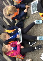 Children looking at a Woodland Walk Search at Stephenson Steam Railway