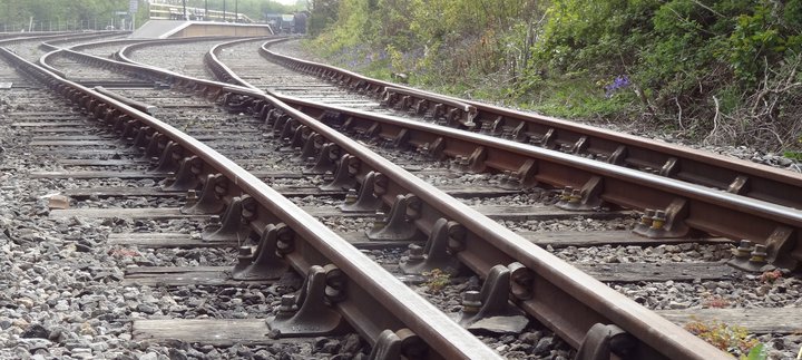 Railway tracks stretching towards the platform