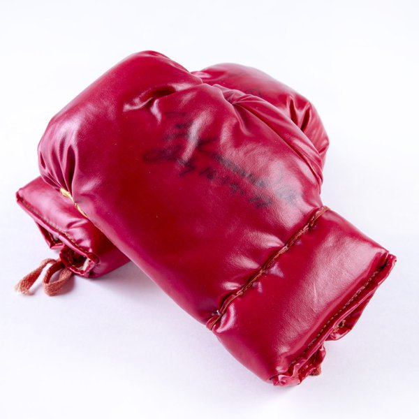 A pair of junior boxing gloves autographed by Muhammad Ali at South Shields, 16 July 1977. 